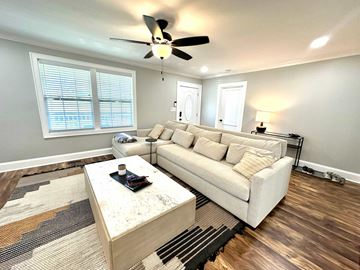 Greenville house for rent - A living room with a white couch and a coffee table.