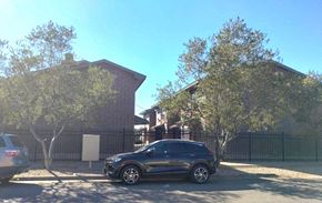 El Paso apartment for rent - A black SUV is parked in a driveway in front of a house.