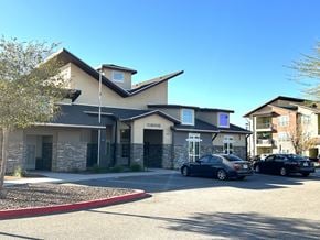 El Paso apartment for rent - A car dealership with two cars parked in front.