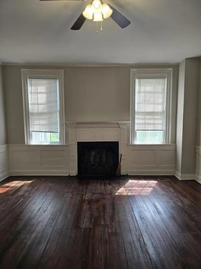 Warrenton apartment for rent - A room with a fireplace and wood floors.