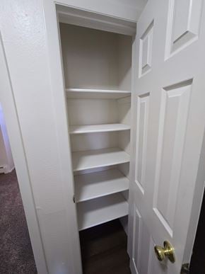 Woodland Park apartment for rent - A white door with a shelf underneath it.