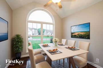 Clarksville house for rent - A dining room with a table set for a meal.