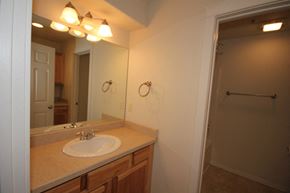 Whitefish apartment for rent - A bathroom with a sink and mirror.