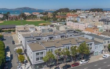 San Francisco apartment for rent - A view of a residential area with houses and cars.