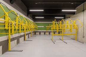Huntsville apartment for rent - A gym with yellow handles and green walls.
