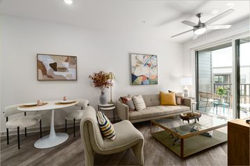Huntsville apartment for rent - A living room with a white table and a beige couch.