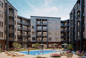 Huntsville apartment for rent - A large apartment complex with a pool in the courtyard.