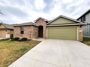 Killeen house for rent - A house with a garage door and a driveway.