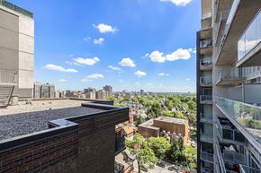 Ottawa apartment for rent - A view from a high-rise building looking down at a cityscape.
