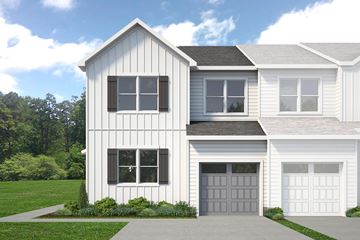 Berlin house for rent - A two-story house with a white exterior and a grey garage door.