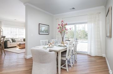 Derry apartment for rent - A dining room with a table set for two and a couch in the background.