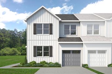 Berlin house for rent - A two-story house with a white exterior and a grey garage door.