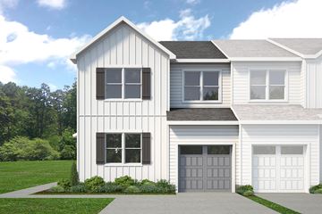 Berlin house for rent - A two-story house with a white exterior and a grey garage door.