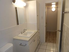 Dallas apartment for rent - A bathroom with a sink, toilet and mirror.