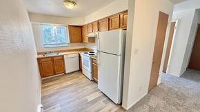 Wheat Ridge apartment for rent - A building with a brown brick facade and a black roof with white trim.