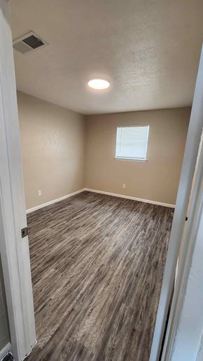 Copperas Cove apartment for rent - A room with a window and a wooden floor.