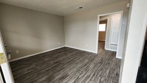 Copperas Cove apartment for rent - A room with wooden flooring and a white door.