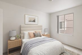 Denver apartment for rent - A bedroom with a large bed and a nightstand with a lamp.