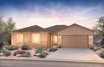 Tucson house for rent - A house with a brown garage door is surrounded by plants and trees.