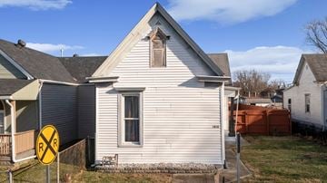 New Albany house for rent - A house with a railroad crossing sign in front of it.