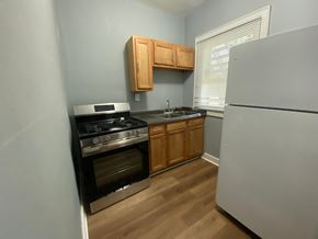 Louisville apartment for rent - A kitchen with a stove, oven, and refrigerator.