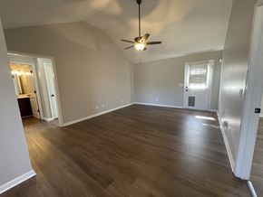 Portland house for rent - A room with wooden flooring and a ceiling fan.