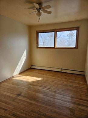 Swift Current apartment for rent - A room with a ceiling fan and a window.