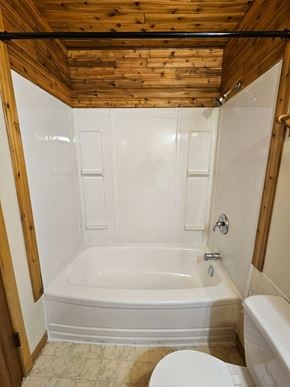 Swift Current apartment for rent - A white bathroom with wooden ceiling and a white tub.