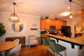Hendersonville house for rent - A kitchen with a table and chairs.
