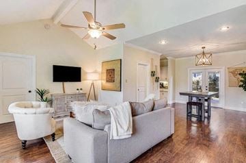 Lafayette house for rent - A living room with a grey couch and a white chair.