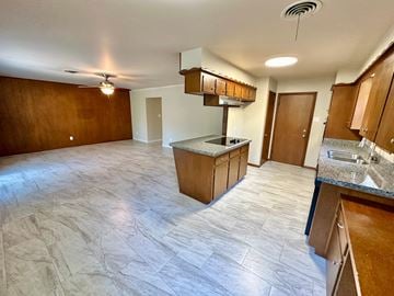 Bay City house for rent - A kitchen with a countertop and cabinets.