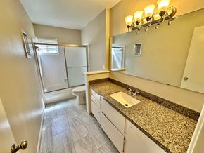 Bay City house for rent - A bathroom with a sink, toilet, and shower.