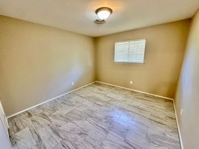 Bay City house for rent - A room with a window and a ceiling light.