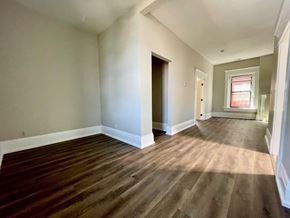 Louisville apartment for rent - A room with wooden flooring and a window.