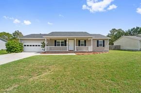 Richlands house for rent - A house with a grey roof and a white garage door.