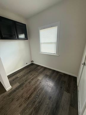 Lima house for rent - A room with a window and wooden flooring.