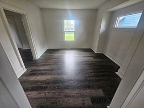 Lima house for rent - A room with wooden flooring and white walls.