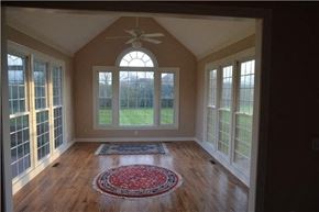 Brentwood house for rent - A room with a ceiling fan and a rug on the floor.