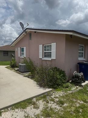 Fort Myers apartment for rent - A house with a satellite dish on the roof.