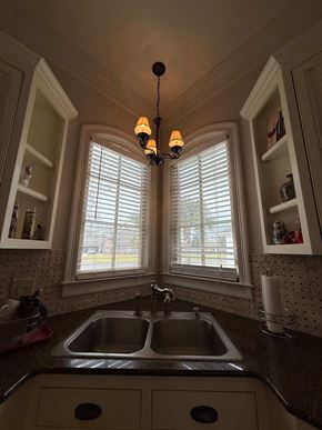 Lafayette house for rent - A kitchen with a sink and a window with blinds.