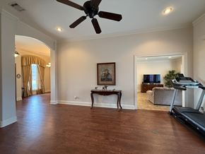 Lafayette house for rent - A spacious room with a ceiling fan and a treadmill.