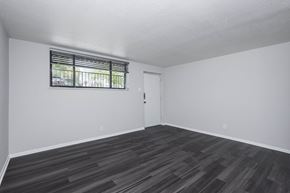 Denver apartment for rent - A room with a window and wooden flooring.