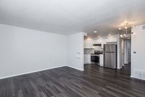 Denver apartment for rent - A kitchen with a refrigerator, oven, and microwave.