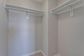 Edmonton apartment for rent - A white closet with two white shelves.