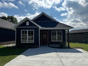 Little Rock house for rent - A blue house with a white door and windows.