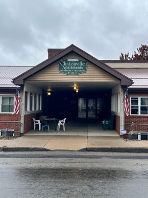 Clintonville apartment for rent - The front of a building with a sign that says Chintonville Apartments.