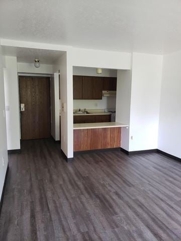 Clintonville apartment for rent - A room with a kitchen area and a doorway.