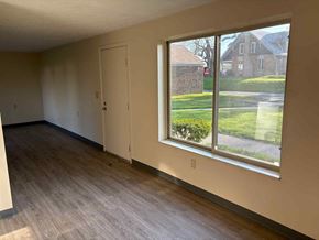 Wapakoneta apartment for rent - A room with a large window and a wooden floor.