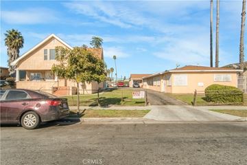 Los Angeles apartment for rent - A residential street with houses and a parked car.
