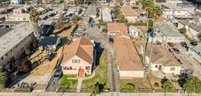 Los Angeles apartment for rent - A residential area with houses and cars.